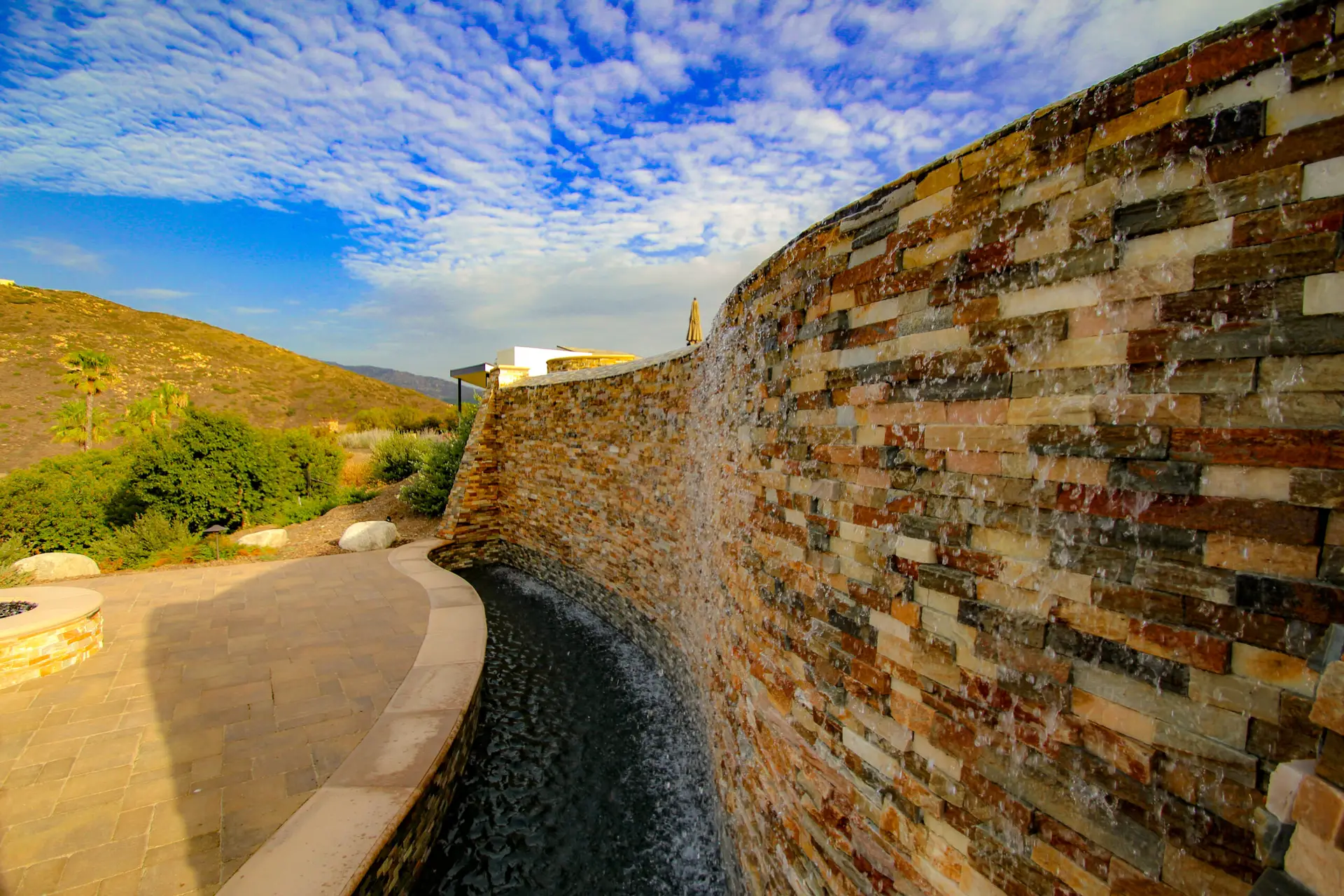 Stone veneer on a retaining wall, built by California Smartscape